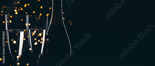 Champagne bottle and champagne glasses photo