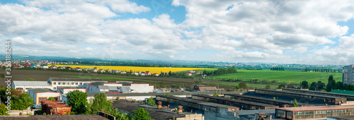 panorama of borders city with Arable lands' blooming rapefield of village near © pavlobaliukh