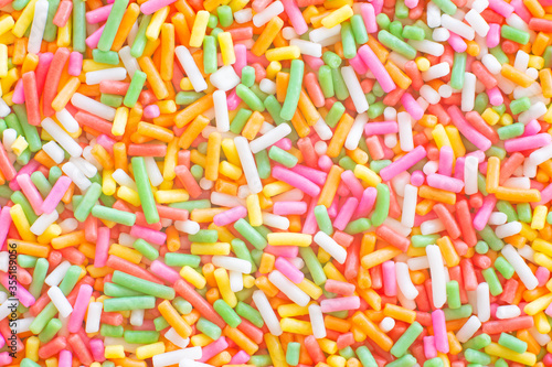 Colorful rainbow sprinkles sugar texture pattern background. for cake , bakery and ice-cream or other