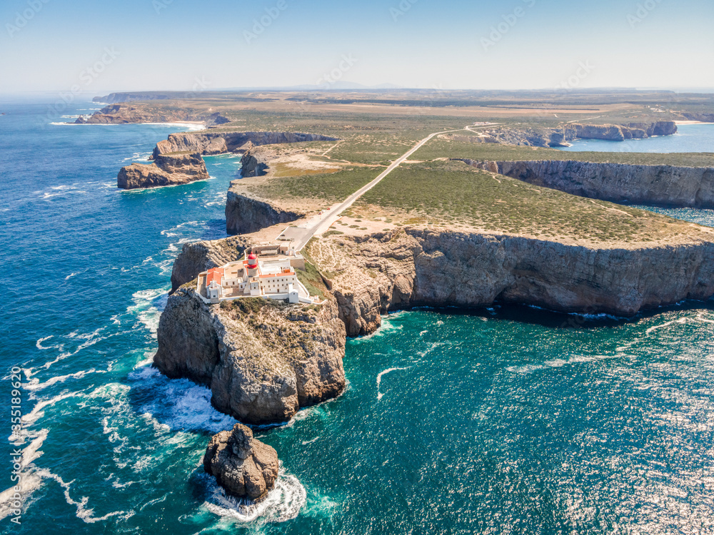 Beautiful lighthouse located on high cliffs of Saint Vincent cape in Algarve, Portugal