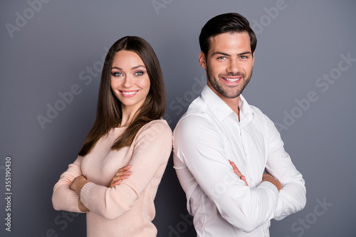 Close-up profile side view portrait of his he her she nice attractive content lovely cheerful cheery couple folded arms isolated over gray violet purple pastel color background