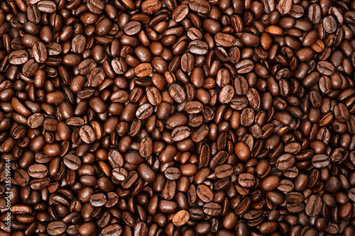 Top view of brown roasted coffee beans, can be use as background, copy space for text. © tonstock