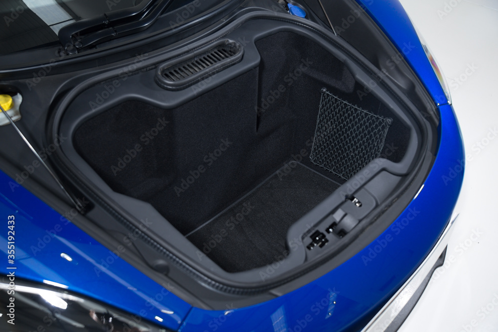 Open front boot space of blue sports car