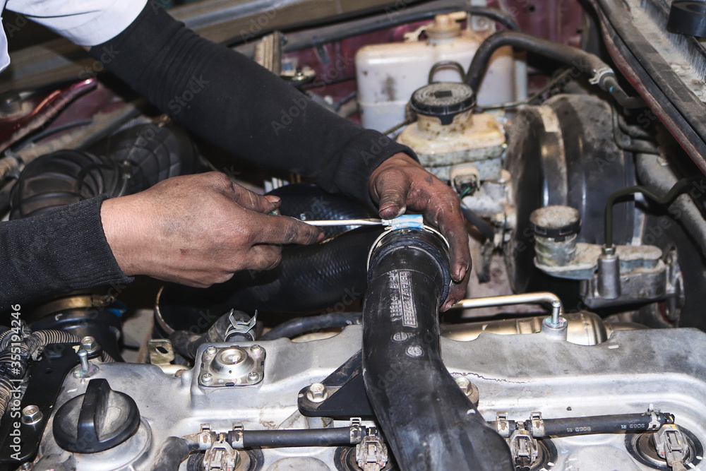 Fototapeta premium The mechanic is checking the engine.