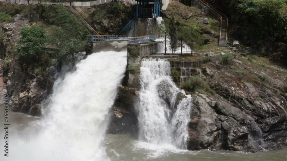 water falling with force in a hydro electric power generation center water falling with force in a hydro electric power generation center