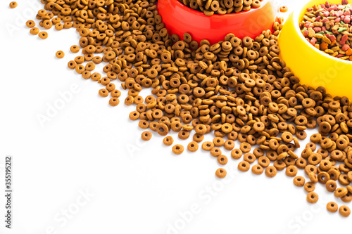 plastic bowl full with dry dog food isolated on white background. Top view grain pet food with copy space of text design. Above or Top view. food texture banner..