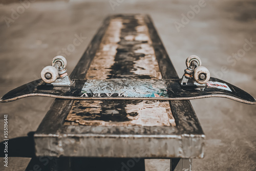 
skateboard in the park on a bench