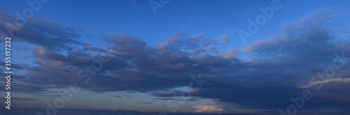  Photo of cumulus clouds.
Panoramic, horizontal image of the atmospheric phenomenon, spring season.