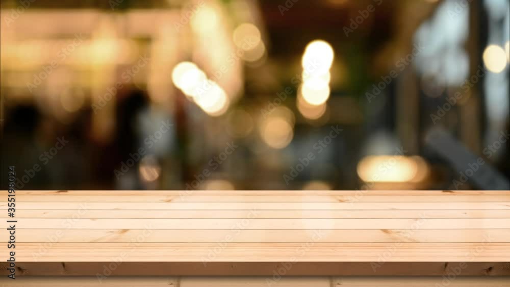 Wooden top table with bokeh light effect and blur restaurant on background Wooden top table with bokeh light effect and blur restaurant on background