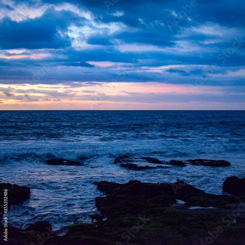 Evening in Tanha Lot, Bali Indonesia, Beautiful Tanha lot beach view in the evening at Bali photo