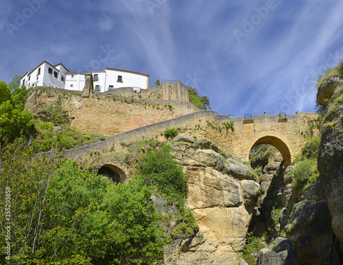 Ronda, Spain at the old Bridge over the Tajo Gorge. Ronda is a city in the Spanish province of Malaga.