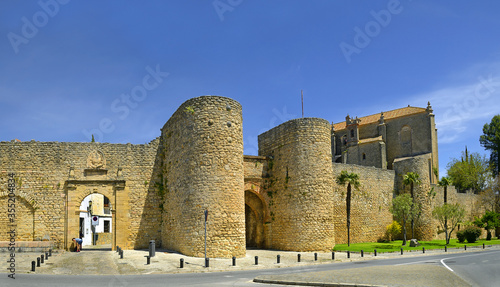 Ronda, Spain. Puerta de Almocabar is one of the most important gates in the city walls. It was built in the 13th century. Ronda is a city in the Spanish province of Malaga.