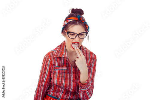 Woman sticking her fingers in her throat showing she is about to throw up,