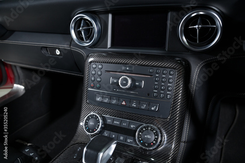 Carbon fiber control buttons in luxurious car interior