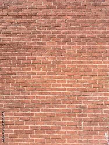 Background image of a red brick wall with running bond brickwork pattern