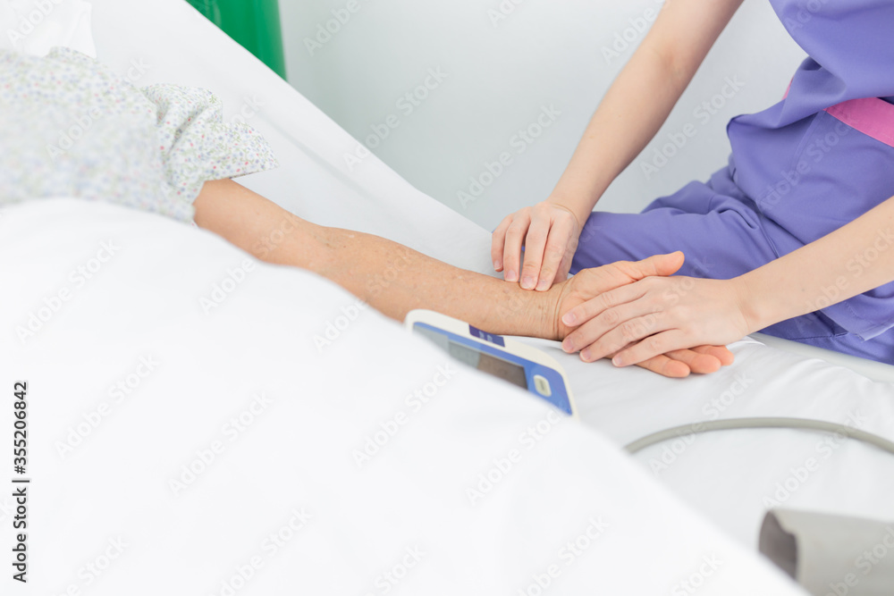 nurse use hand screening vital sign of old asian patient , healthcare worker treatment patient in hospital, elderly health check up , palliative care nurse use hand screening vital sign of old asian patient , healthcare worker treatment patient in hospital, elderly health check up , palliative care
