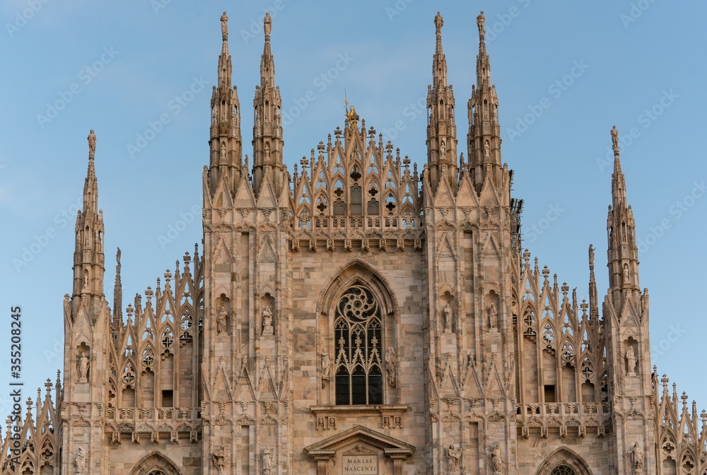 Detail of The Milan Cathedral (Milan Duomo) on blue sky, Milan (Milano), Italy Detail of The Milan Cathedral (Milan Duomo) on blue sky, Milan (Milano), Italy
