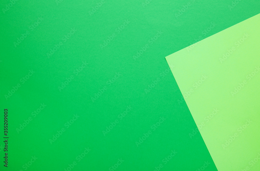 Color papers flat composition background with light and dark green Color papers flat composition background with light and dark green