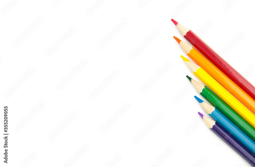 LGBT pride rainbow flag made of six colored pencils on white LGBT pride rainbow flag made of six colored pencils on white