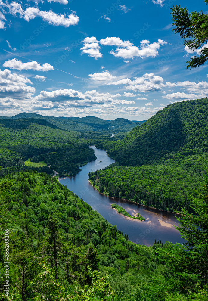 Fototapeta premium Awesome summer view from a verdant hill in Jacques Cartier National Park, Quebec province, Canada