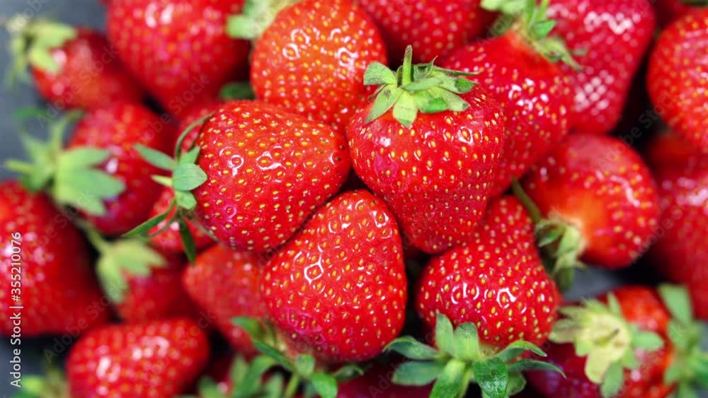 Macro Top View of Heap of Fresh Tasty Ripe Strawberries Rotates Macro Top View of Heap of Fresh Tasty Ripe Strawberries Rotates