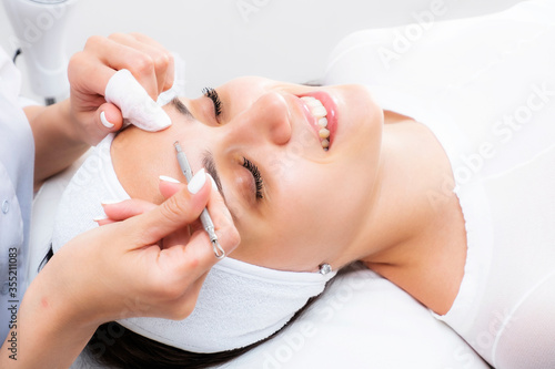 Photo facial cleansing cosmetology. Aesthetic cosmetology. Mechanical face peel. Skin acne treatment.