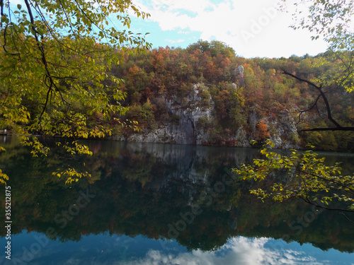autumn trees reflected in water