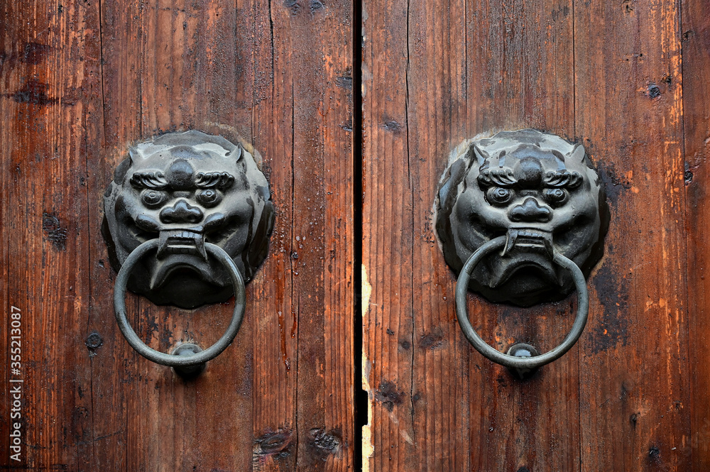 Retro decorative door rings on wooden doors of traditional Chinese architecture Retro decorative door rings on wooden doors of traditional Chinese architecture