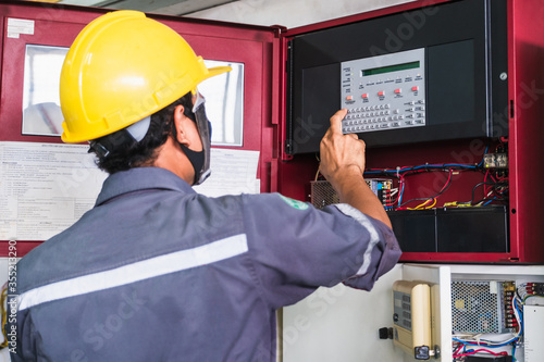 Technician Checking doing work Maintenance fire alarm system in a factory Fire protection Factory safety Qiao Shan Installation control detector emergency risk