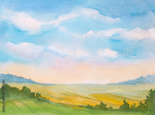 Wall Mural watercolor sunrise landscape with blue sky and clouds and green grass