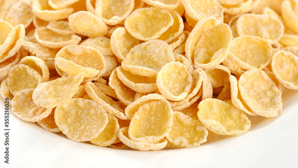 Corn flake in white plate, macro shot. healthy breakfast Corn flake in white plate, macro shot. healthy breakfast