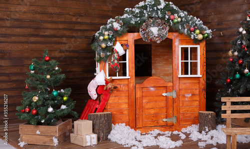 Decorated Christmas interior with kittle house for children photo