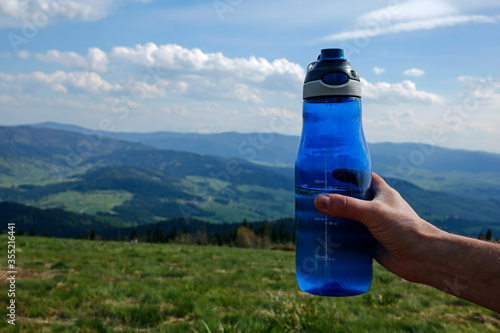 Fototapeta Naklejka Na Ścianę i Meble -  sport water bottle in the mountains