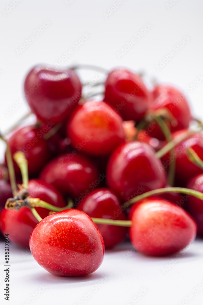 heap of ripe cherries on white background heap of ripe cherries on white background