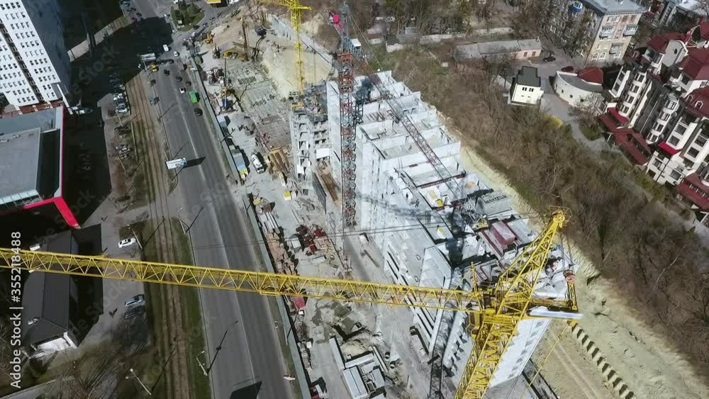 Aerial of construction crane on site building multistory houses Aerial of construction crane on site building multistory houses
