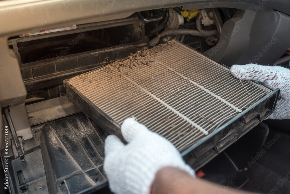 Car air conditioner filter in the cabin of the car is dirty and damaged