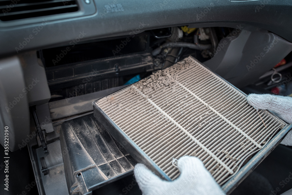 Car air conditioner filter in the cabin of the car is dirty and damaged