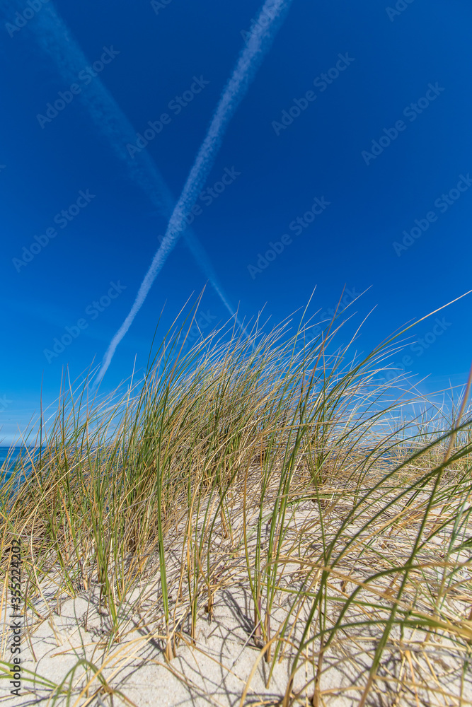 condensation trail marked an X on seaside condensation trail marked an X on seaside