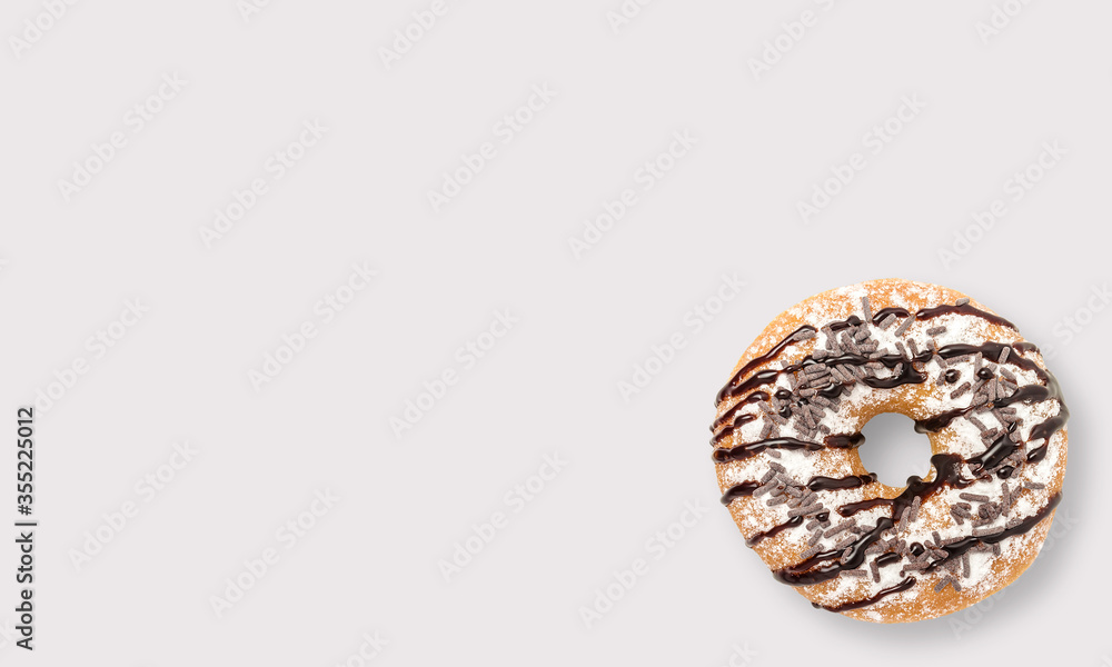 Glazed donut with sprinkles on a white background