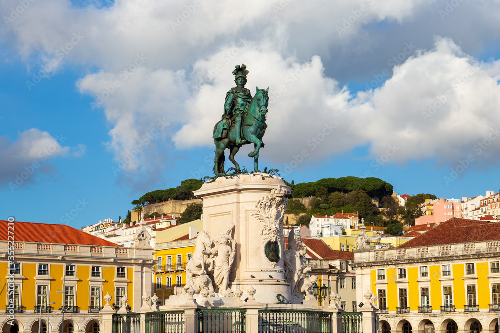 Lisbon Portugal: Praca do Comercio - Commerce Square featuring an equestrian statue of King Dom Jose I as the prominent landmark. Old city center in the famous tourist destination.