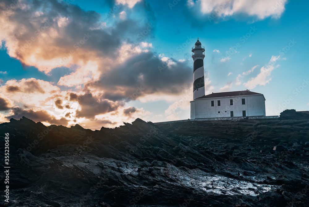 lighthouse during dawn in a winter day with cloudy sky