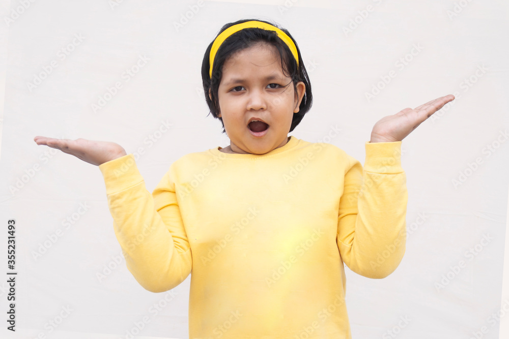 Portrait Of Girl With Arms Raised While Standing Against White Background
Portrait Of Girl With Arms Raised While Standing Against White Background