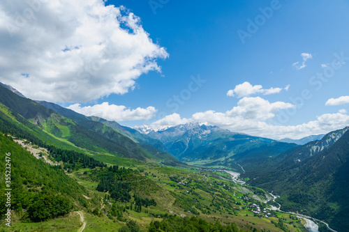 Svaneti mountain and village landscape at the trekking and hiking route near Mestia village in Svaneti region, UNESCO heritage area in Georgia. © uskarp2