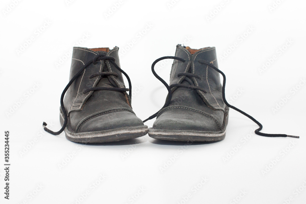 Old Black male shoes isolated on white