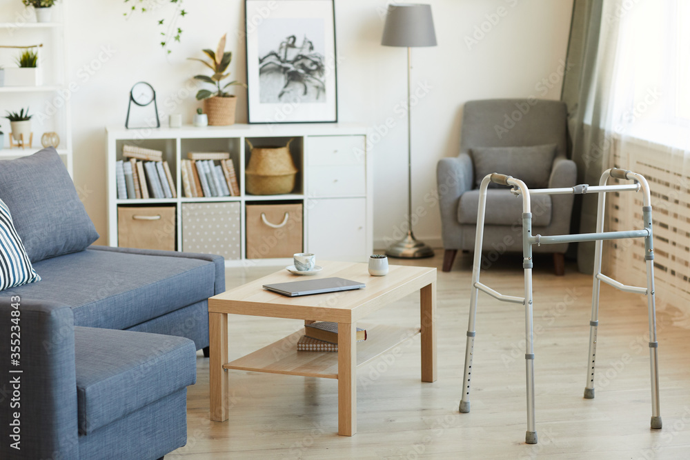 Image of empty domestic living room with walker for senior people Image of empty domestic living room with walker for senior people