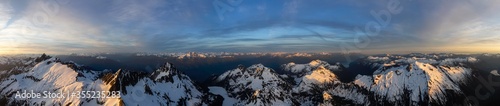 Aerial Panoramic View of Canadian Mountain Landscape  Tantalus Range  during a colorful sunset. Taken near Squamish  North of Vancouver  British Columbia  Canada. Nature Background Panorama