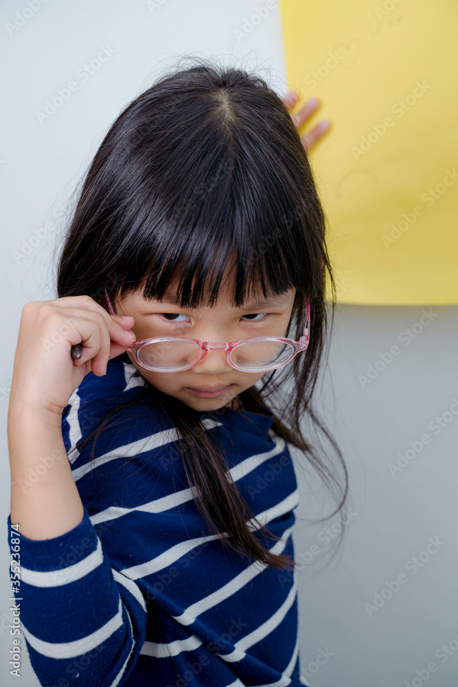 Emotional child. Cute upset little asian girl standing isolated over gray background. children kid screaming expression on isolated background Emotional child. Cute upset little asian girl standing isolated over gray background. children kid screaming expression on isolated background