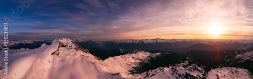 Aerial Panoramic View of Canadian Mountain Landscape during a colorful sunset. Taken in Garibaldi, near Whistler and Squamish, North of Vancouver, British Columbia, Canada. Nature Background Panorama