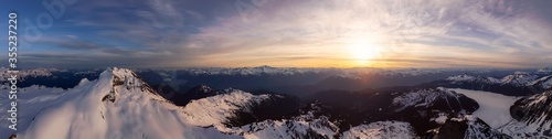 Aerial Panoramic View of Canadian Mountain Landscape during a colorful sunset. Taken in Garibaldi  near Whistler and Squamish  North of Vancouver  British Columbia  Canada. Nature Background Panorama