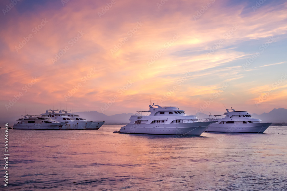 Sunset sea horizon view with yachts Sunset sea horizon view with yachts